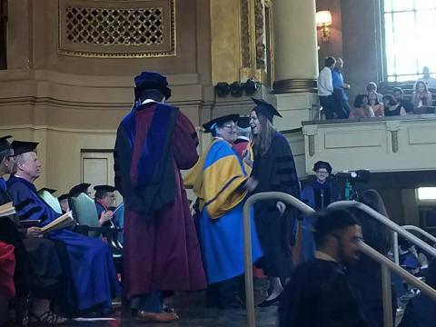 Elisabeth Becker and Andrew Cohen receiving degrees